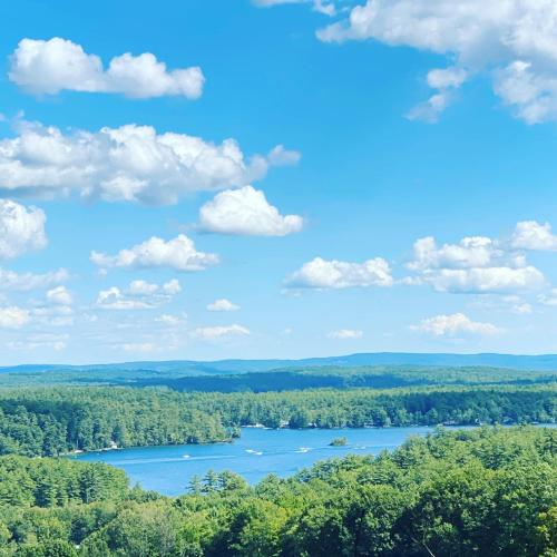 a view of a lake from the top of a hill at Cottage 7 - Stand Alone 1 Bedroom / 1 Bath in Wolfeboro