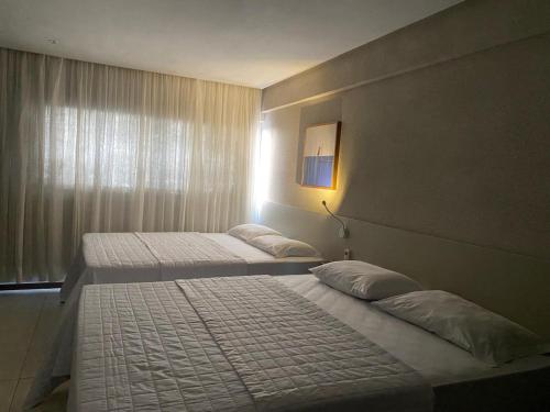 Postel nebo postele na pokoji v ubytování Loft 1 Edf celita Franca Business hotel