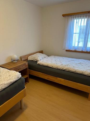 Postel nebo postele na pokoji v ubytování Ferienwohnung Engadin Barbey