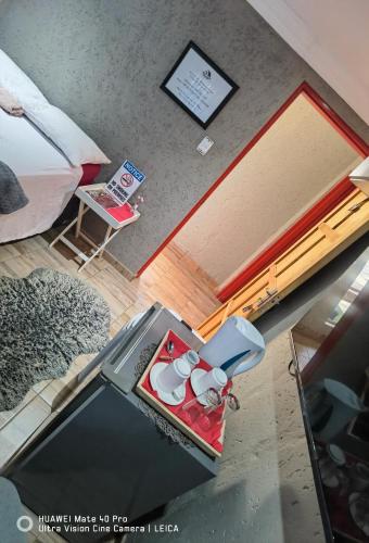 a model of a bedroom with a bed and a table at Fresh Ideas GuestHouse in Soshanguve