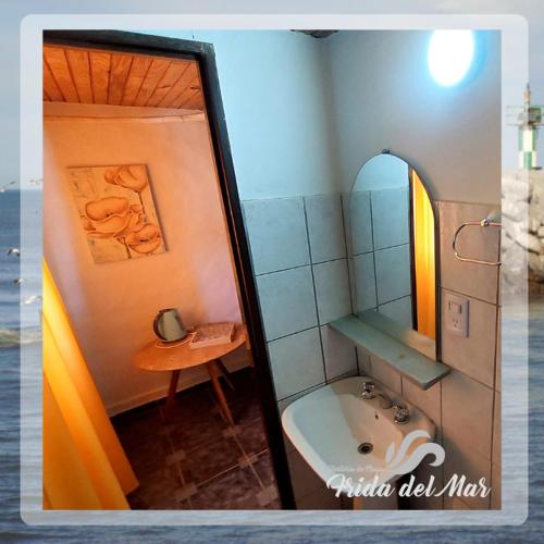 a bathroom with a sink and a mirror at Frida del Mar in Playa Unión