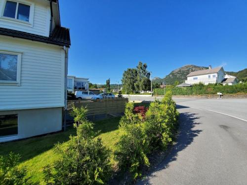 a house with bushes on the side of the road at Beautiful Central Apartmant in Strand