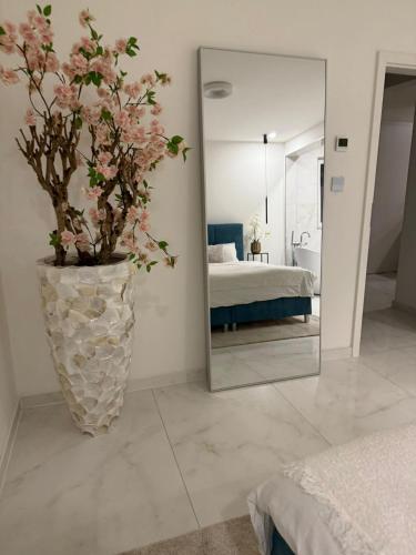 Ένα ή περισσότερα κρεβάτια σε δωμάτιο στο Luxrem Apartments 4