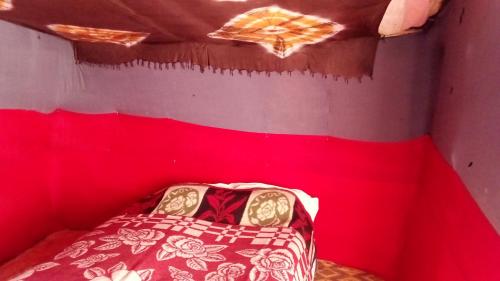 Ένα ή περισσότερα κρεβάτια σε δωμάτιο στο ERG MERZOUGA SAHARA CAMP