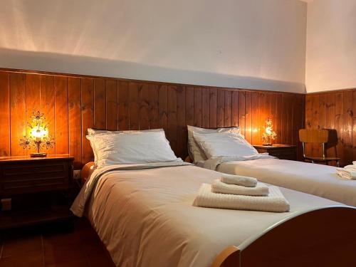 two beds in a bedroom with two lamps and two beds sidx sidx sidx at Good Stay Borno in Borno