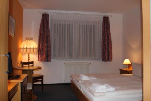 Postel nebo postele na pokoji v ubytování Hotel Riedel