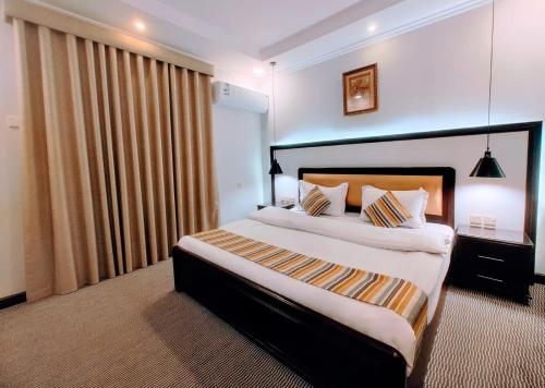 Katil atau katil-katil dalam bilik di AL Mokhmalia Serviced Apartments