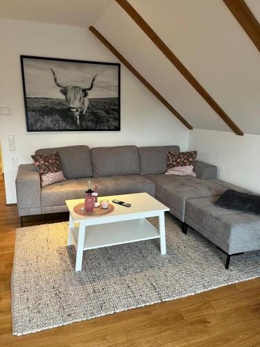 a living room with a couch and a coffee table at Lerchennest Nottuln in Nottuln