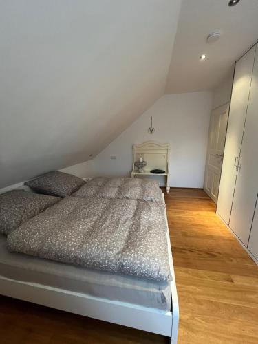 a bedroom with a bed in a attic at Lerchennest Nottuln in Nottuln