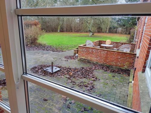 a view from a window of a yard at Guest house on farm in small village in Næstved