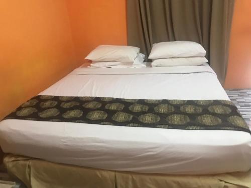 a bed in a room with at Ztg janda baik retreat in Bentong
