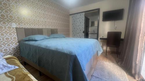 Postel nebo postele na pokoji v ubytování Quarto Aconchegante N 2