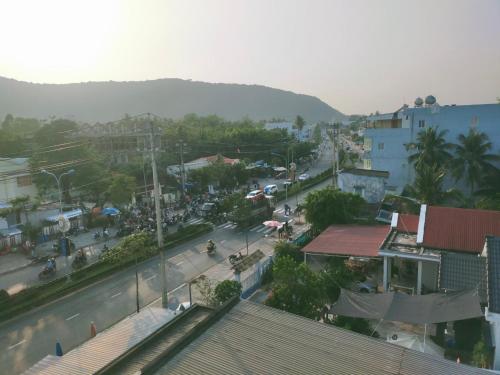 a view of a street in a city with buildings at Lotus Phú Quốc Hotel in Phu Quoc