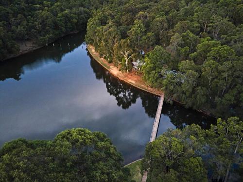 an aerial view of a river with trees at Evedon Lakeside Retreat in Burekup