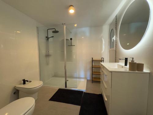 a bathroom with a shower and a toilet and a sink at Casa del Rebaldi in Jávea