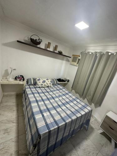 Katil atau katil-katil dalam bilik di Chalé com piscina e churrasqueira