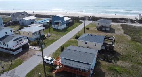 an aerial view of houses and the beach at A Drunken Parrots Beach Side Paradise in North Topsail Beach