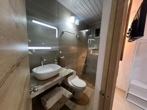 a bathroom with a toilet and a sink and a shower at SWEET BREEZE in San Andrés