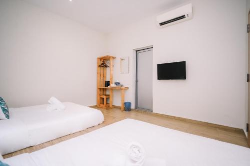 Un ou plusieurs lits dans un hébergement de l'établissement Swing & Pillows - Kota Warisan, Sepang