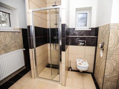 a bathroom with a shower and a toilet at Villa in Fren tát near Ski Resorts & Jacuzzi in Frenštát pod Radhoštěm