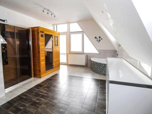 a bathroom with a sink and a bath tub at Villa in Fren tát near Ski Resorts & Jacuzzi in Frenštát pod Radhoštěm