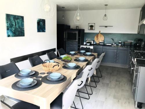 a dining room with a wooden table and chairs at Villa in Tanvald near Ski Slopes in Tanvald