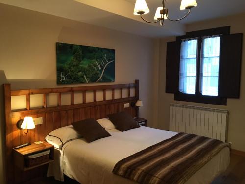 Postel nebo postele na pokoji v ubytování Hostal Otsoa