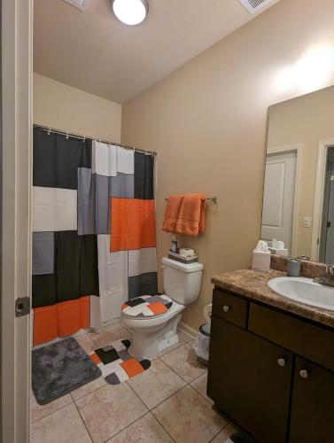 a bathroom with a toilet and a sink at Home away from Home - Book Friday and Saturday Get Sunday Free! Sleeps 7 Immediate Availability! Beautiful Gated Community in Charlotte