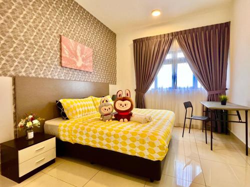 two stuffed animals sitting on a bed in a bedroom at Legoland-8min walk at Kairos Comfort Spacious Suite for Families 1-12pax in Nusajaya