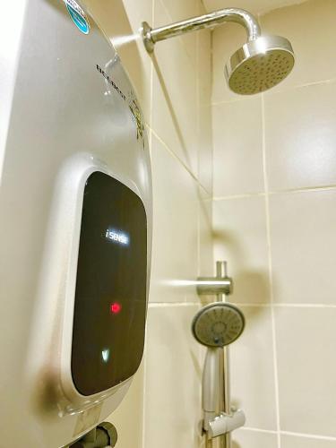 a urinal in a bathroom with a shower at Legoland-8min walk at Kairos Comfort Spacious Suite for Families 1-12pax in Nusajaya