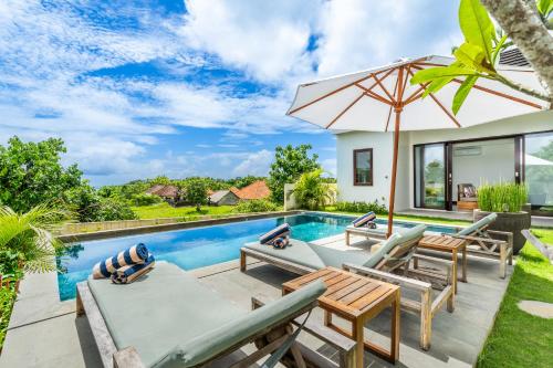 an image of a villa with a swimming pool at Akasia Hill Villas in Nusa Dua