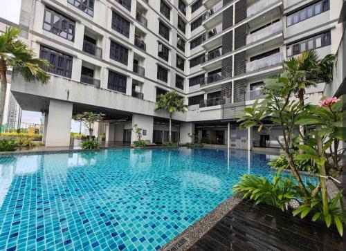 a large swimming pool in front of a building at Meridin Sovo 1Bed Healing Space Netflix By STAY in Iskandar Puteri