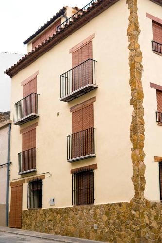 a building with balconies on the side of it at Casa Rural Rosa in Cabanes