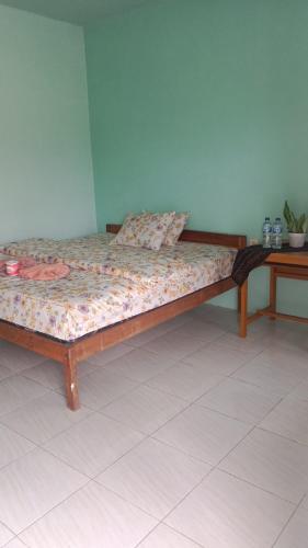 Ένα ή περισσότερα κρεβάτια σε δωμάτιο στο Rice field guest house