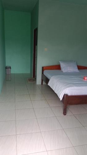 Ένα ή περισσότερα κρεβάτια σε δωμάτιο στο Rice field guest house