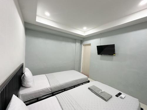 Postel nebo postele na pokoji v ubytování Ghaza Guest House