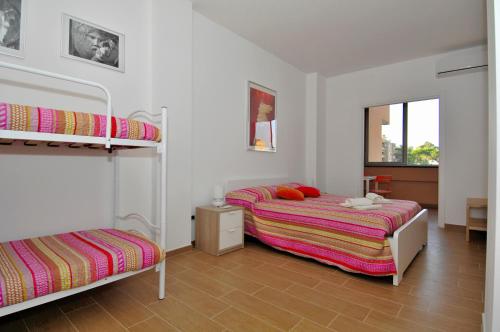 A bed or beds in a room at B&B Nonna Roma
