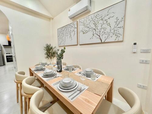 a dining room with a wooden table and chairs at Fiesta Villa Samui in Koh Samui 