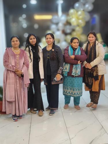 a group of women standing next to each other at The Shalam Resort श्रीकृष्ण शरणं मम in Lansdowne