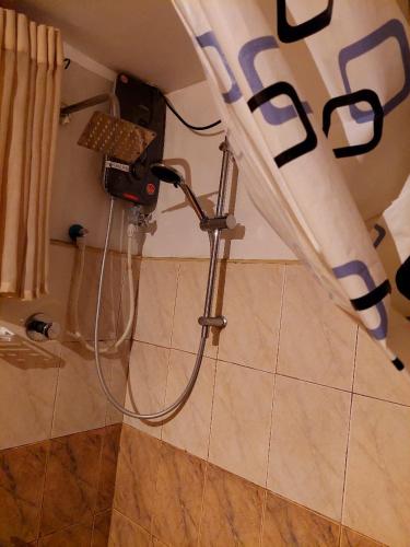 a shower in the corner of a bathroom at Golden Villa Kandy in Kandy