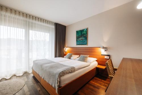 Postel nebo postele na pokoji v ubytování Hotel Rakar