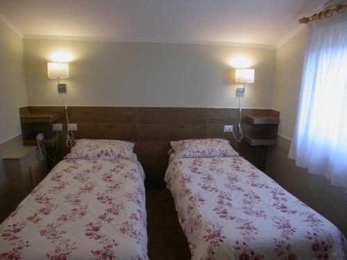 Una cama o camas en una habitación de Hotel Il Roscio