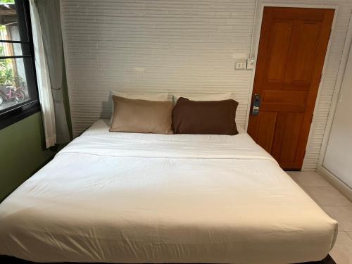 Кровать или кровати в номере Baan Yaimai Boutique Samui