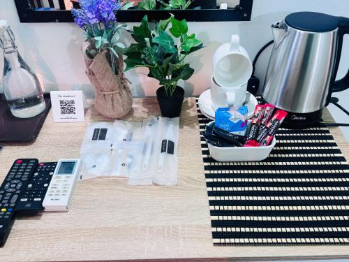 a counter top with a coffee maker and a blender at The Park House in Male City