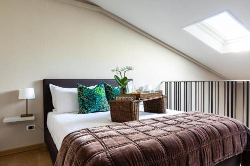 a bedroom with a bed with wicker baskets on it at Hotel Porta San Mamolo in Bologna