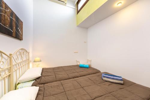 Ένα ή περισσότερα κρεβάτια σε δωμάτιο στο Casa Violeta I