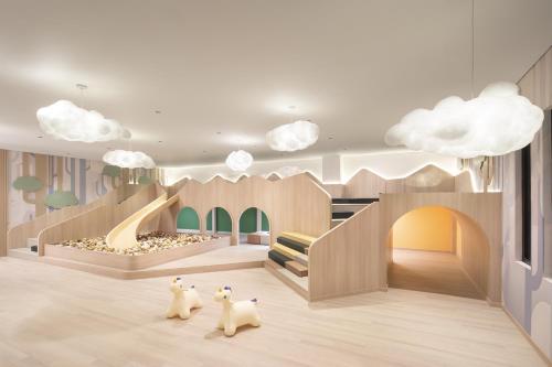 a rendering of a childrens play room with cats walking around at Modena by Fraser Vinh Yen in Yen