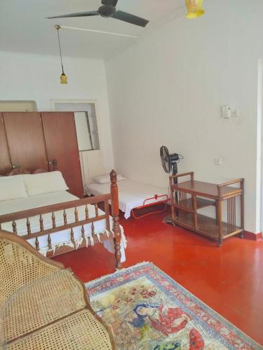 a living room with a couch and a table at No 06 Veediya Bandara Lane Bahirawakanda in Kandy