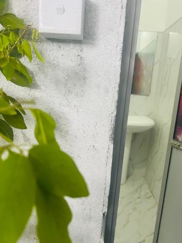a bathroom with a mirror and a sink at Night manner hostel in Ella