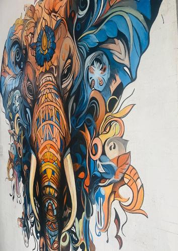a painting of an elephant with tusks at Night manner hostel in Ella